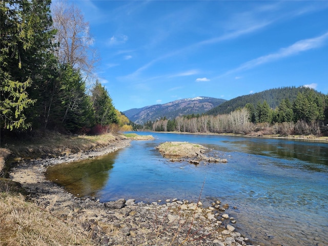74 Cedar Crk, Libby, MT 59923 - water view with mountains and a forest