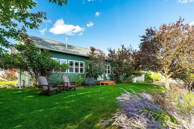74 Cedar Crk, Libby, MT 59923 - view of grassy yard with a wooden deck