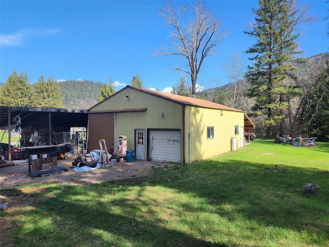 74 Cedar Crk, Libby, MT 59923 - view of pole building featuring a lawn