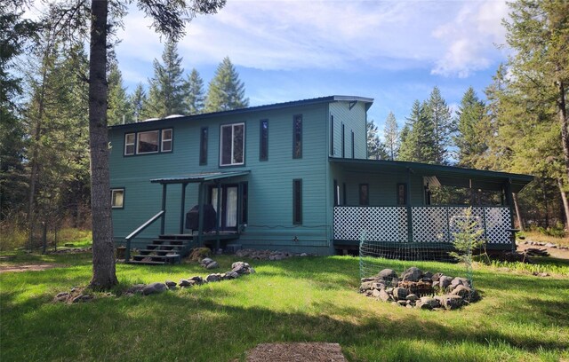 74 Cedar Crk, Libby, MT 59923 - rear view of property with a yard