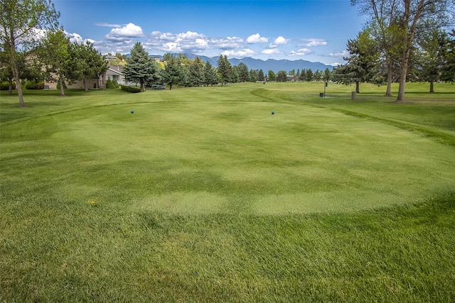 237 W Nicklaus Ave, Kalispell, MT 59901 - view of community with golf course view, a mountain view, and a lawn