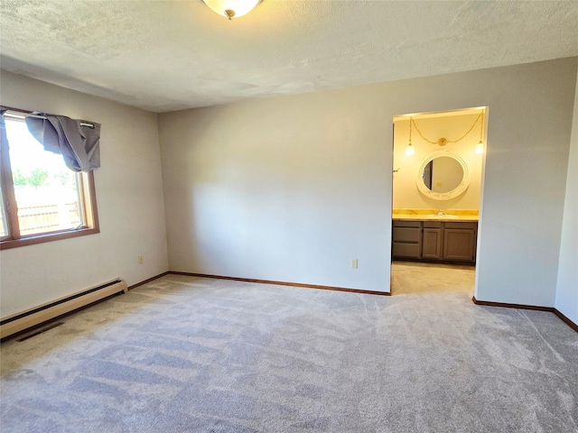 1401 Park Garden Rd, Great Falls, MT 59404 - spare room featuring light carpet, a textured ceiling, and a baseboard heating unit