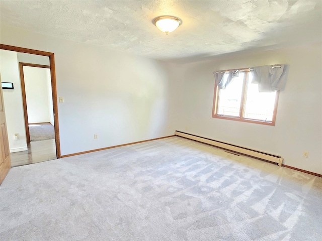 1401 Park Garden Rd, Great Falls, MT 59404 - unfurnished room featuring a baseboard radiator, carpet floors, and a textured ceiling