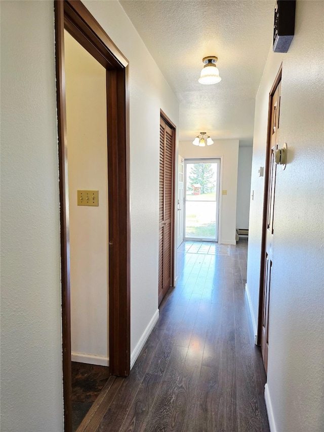 1401 Park Garden Rd, Great Falls, MT 59404 - corridor featuring dark wood-style flooring and a textured ceiling