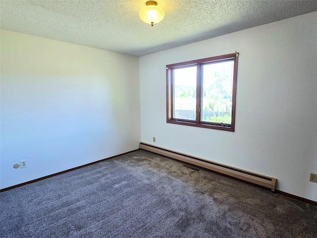 1401 Park Garden Rd, Great Falls, MT 59404 - empty room featuring a baseboard heating unit, carpet flooring, and a textured ceiling