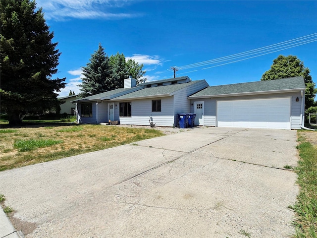 1401 Park Garden Rd, Great Falls, MT 59404 - ranch-style house featuring driveway, an attached garage, a chimney, and a front lawn