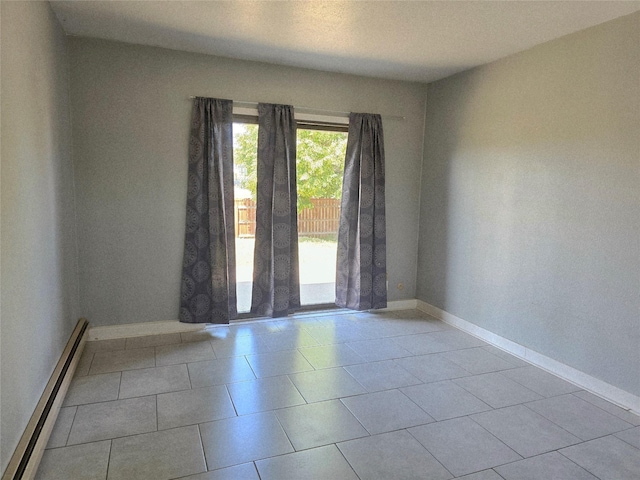 1401 Park Garden Rd, Great Falls, MT 59404 - tiled spare room with a baseboard heating unit and baseboards