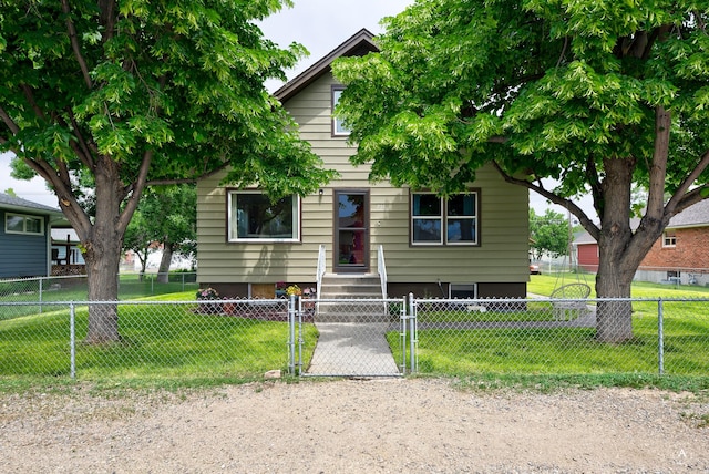 216 W Riggs St, East Helena, MT 59635 - view of front of home with a gate and a fenced front yard