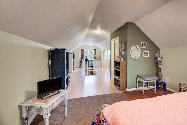 216 W Riggs St, East Helena, MT 59635 - carpeted bedroom featuring vaulted ceiling and baseboards