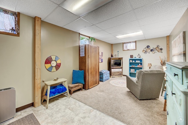 216 W Riggs St, East Helena, MT 59635 - living room featuring a paneled ceiling and tile patterned floors