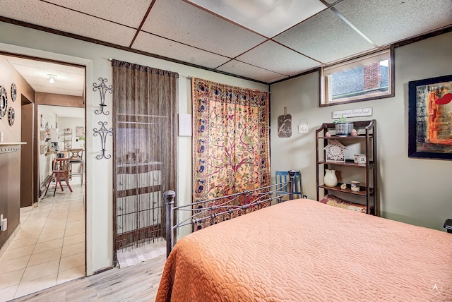 216 W Riggs St, East Helena, MT 59635 - bedroom with light wood finished floors and a drop ceiling