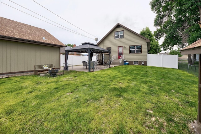 216 W Riggs St, East Helena, MT 59635 - rear view of house featuring a gazebo, a fenced backyard, and a patio area