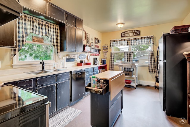 216 W Riggs St, East Helena, MT 59635 - kitchen with freestanding refrigerator, dishwasher, range with electric stovetop, and light countertops