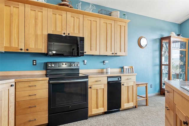 467 Ridgeway Dr, Lolo, MT 59847 - kitchen with light brown cabinetry, black appliances, light carpet, and light countertops