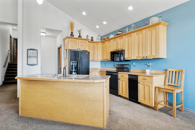 467 Ridgeway Dr, Lolo, MT 59847 - kitchen featuring black appliances, light colored carpet, light brown cabinets, light countertops, and recessed lighting