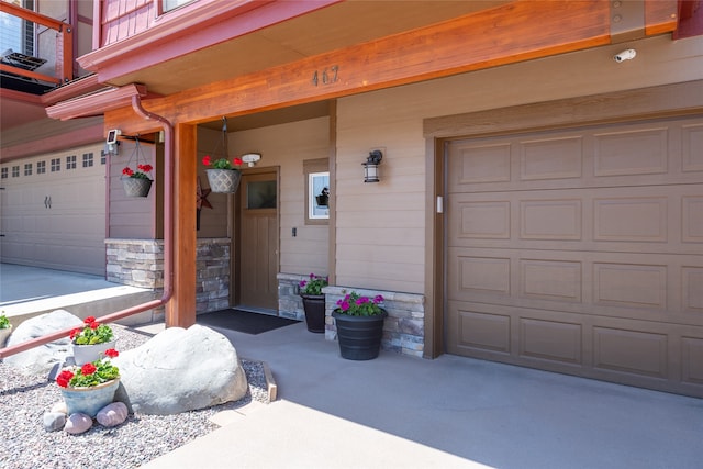 467 Ridgeway Dr, Lolo, MT 59847 - doorway to property featuring an attached garage and driveway