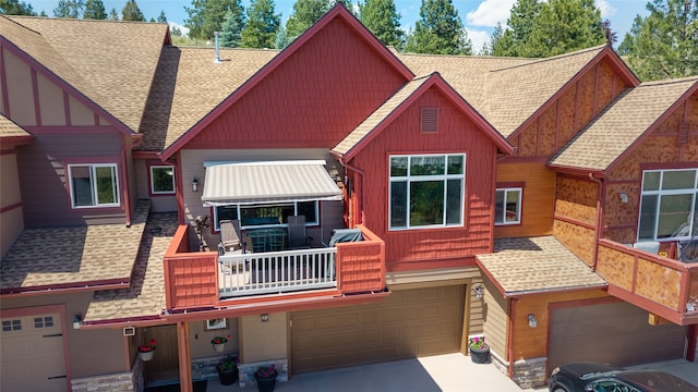 467 Ridgeway Dr, Lolo, MT 59847 - view of front of house with a garage, a shingled roof, and board and batten siding