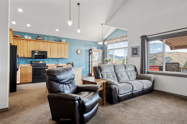 467 Ridgeway Dr, Lolo, MT 59847 - living area with light colored carpet, recessed lighting, a chandelier, and high vaulted ceiling