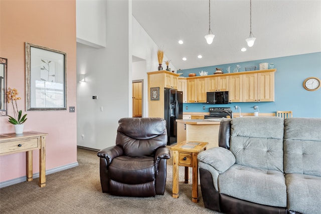 467 Ridgeway Dr, Lolo, MT 59847 - living area with high vaulted ceiling, light carpet, and recessed lighting