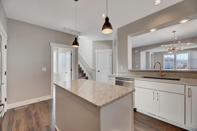 2933 Travis Ave, Helena, MT 59601 - kitchen with a chandelier, dark wood-style floors, light stone countertops, and recessed lighting
