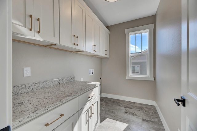 2933 Travis Ave, Helena, MT 59601 - laundry room with cabinet space and hookup for a washing machine