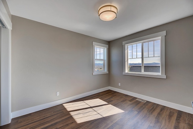 2933 Travis Ave, Helena, MT 59601 - unfurnished room with baseboards and dark wood finished floors