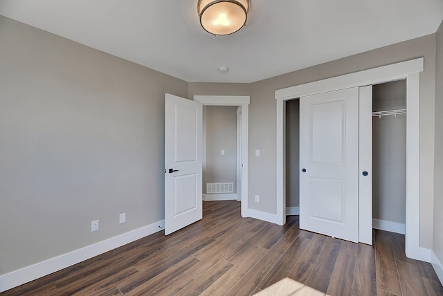 2933 Travis Ave, Helena, MT 59601 - unfurnished bedroom with dark wood-style flooring and a closet