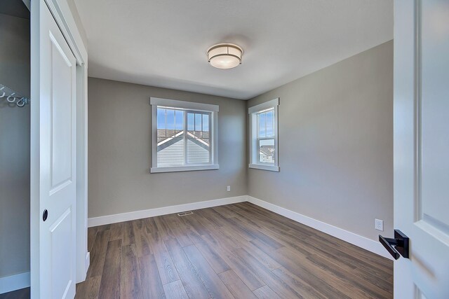 2933 Travis Ave, Helena, MT 59601 - unfurnished room featuring dark wood-style flooring and baseboards