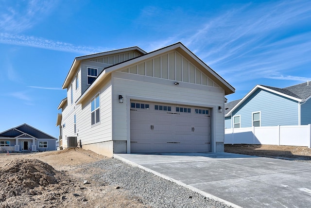 2933 Travis Ave, Helena, MT 59601 - view of side of property with board and batten siding and driveway