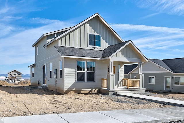 2933 Travis Ave, Helena, MT 59601 - view of front of property featuring board and batten siding, covered porch, and roof with shingles