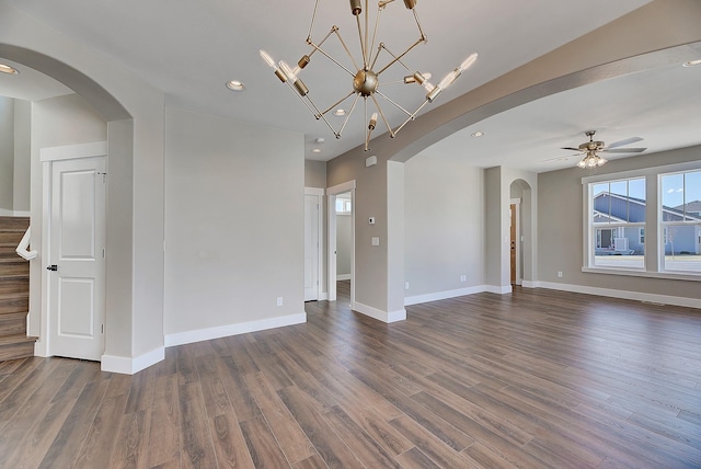 2933 Travis Ave, Helena, MT 59601 - unfurnished living room featuring arched walkways, dark wood finished floors, recessed lighting, and ceiling fan