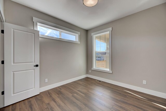 2933 Travis Ave, Helena, MT 59601 - empty room with dark wood finished floors and baseboards