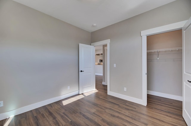 2933 Travis Ave, Helena, MT 59601 - unfurnished bedroom with dark wood-type flooring and a closet