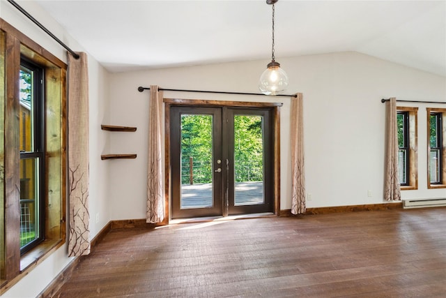 28578 Wapiti Ln, Bigfork, MT 59911 - unfurnished dining area featuring vaulted ceiling, hardwood / wood-style floors, healthy amount of natural light, and a baseboard radiator