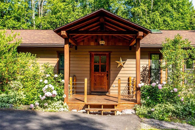 28578 Wapiti Ln, Bigfork, MT 59911 - doorway to property with a shingled roof