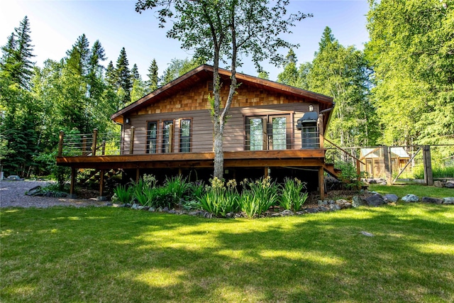 28578 Wapiti Ln, Bigfork, MT 59911 - back of property with a deck and a yard