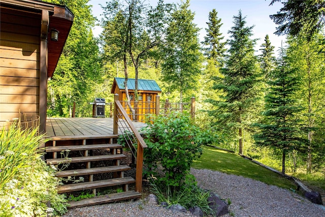 28578 Wapiti Ln, Bigfork, MT 59911 - view of yard with a wooden deck, stairs, and a shed