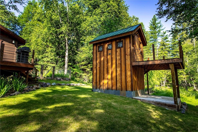 28578 Wapiti Ln, Bigfork, MT 59911 - view of grassy yard featuring a wooden deck and stairway
