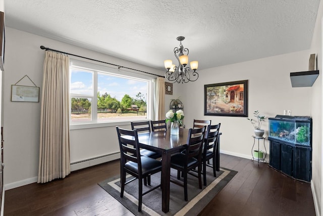 3906 Bellecrest Dr, Missoula, MT 59801 - dining space featuring a baseboard heating unit, a chandelier, a textured ceiling, and dark wood-style floors