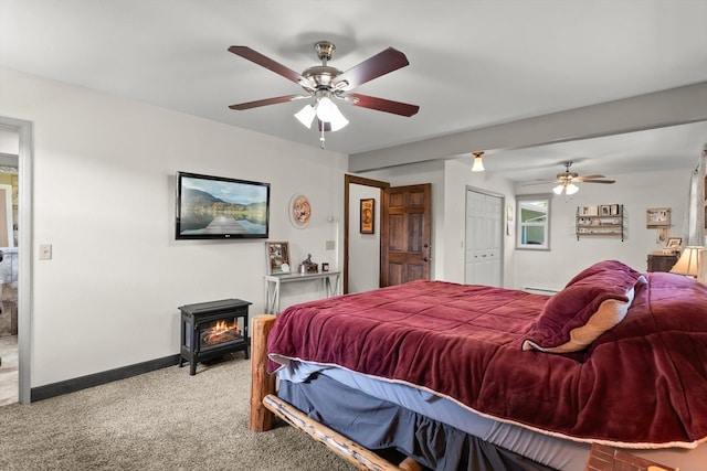 3906 Bellecrest Dr, Missoula, MT 59801 - carpeted bedroom with a wood stove, ceiling fan, and a closet