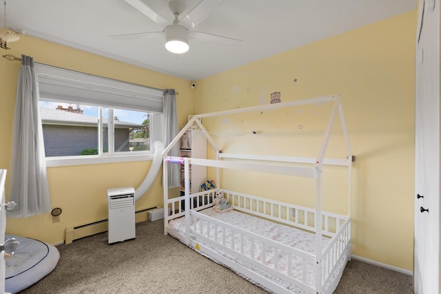 3906 Bellecrest Dr, Missoula, MT 59801 - carpeted bedroom featuring a baseboard heating unit and a ceiling fan