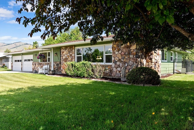 3906 Bellecrest Dr, Missoula, MT 59801 - ranch-style home with stone siding and a garage