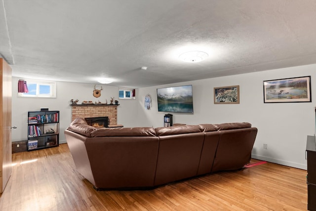 3906 Bellecrest Dr, Missoula, MT 59801 - living area featuring a fireplace, light wood-type flooring, and a textured ceiling