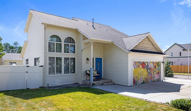 2702 Fleet St, Missoula, MT 59808 - view of front of home featuring a garage, concrete driveway, a gate, and roof with shingles