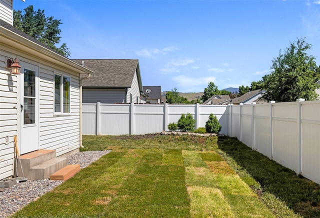 2702 Fleet St, Missoula, MT 59808 - fenced backyard with a mountain view and entry steps