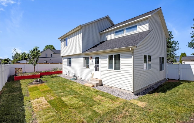 2702 Fleet St, Missoula, MT 59808 - back of property featuring entry steps, a fenced backyard, a shingled roof, and a gate