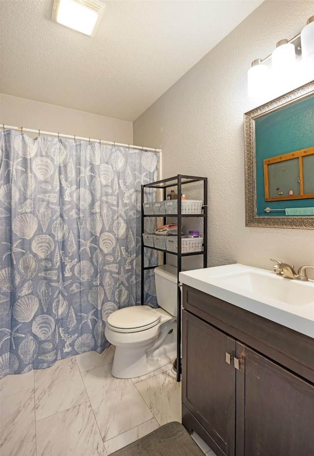 2702 Fleet St, Missoula, MT 59808 - bathroom with vanity, marble look tile flooring, a textured wall, a textured ceiling, and a shower with curtain