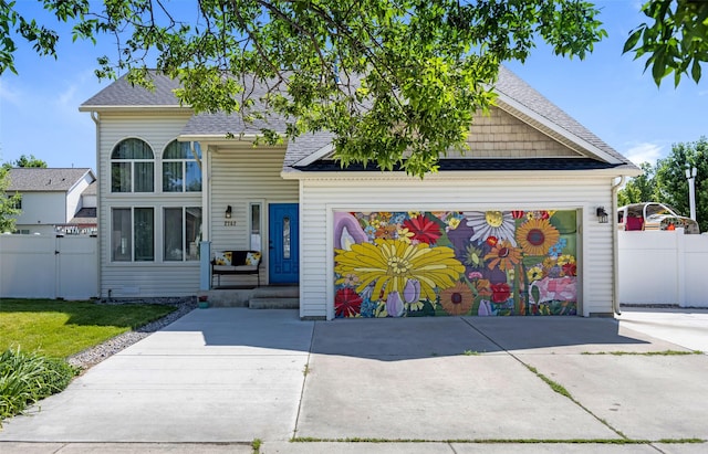 2702 Fleet St, Missoula, MT 59808 - view of front facade with a shingled roof and concrete driveway