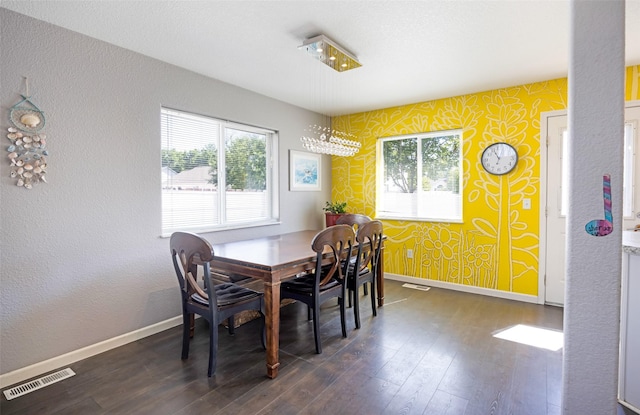 2702 Fleet St, Missoula, MT 59808 - dining space with wallpapered walls, dark wood-style floors, and plenty of natural light