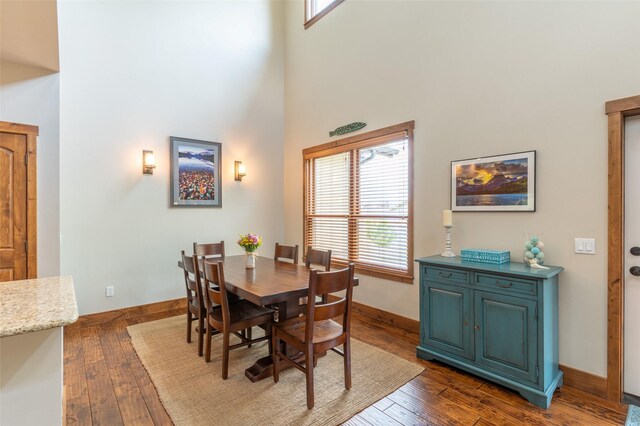 6008 St Moritz Dr Unit K, Whitefish, MT 59937 - dining area featuring a towering ceiling and dark wood finished floors
